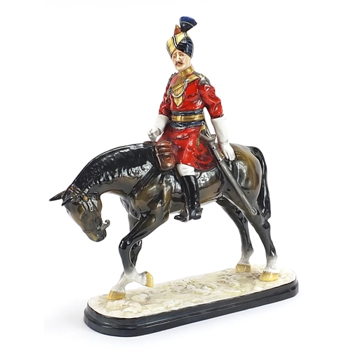 1291 - Michael Sutty large porcelain figure of a soldier on horseback, 38cm high