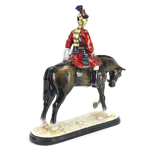 1291 - Michael Sutty large porcelain figure of a soldier on horseback, 38cm high