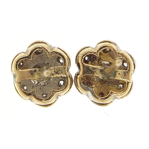 1800 - Pair of unmarked gold diamond flower head stud earrings, 9mm in diameter, 1.7g