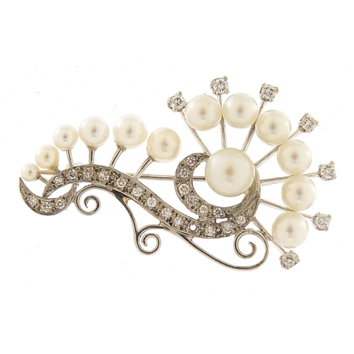 1643 - Palladium diamond and cultured pearl brooch housed in a Cadari box, 4.2cm wide, 7.3g