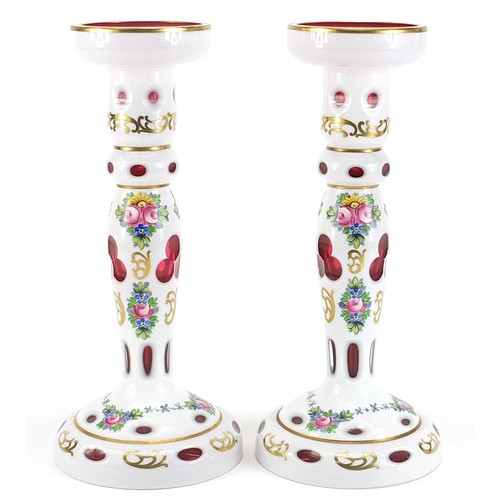 269 - Attributed to Moser, pair of Bohemian white overlaid cranberry glass candle holders, hand painted wi... 