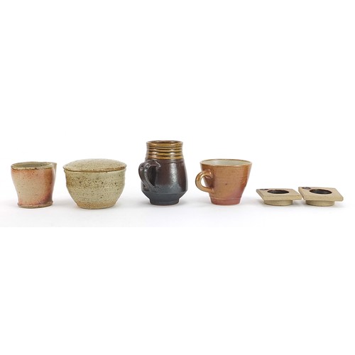 113 - Studio pottery including jugs by Mary Rich and Phil Rogers and a pair of candleholders, the largest ... 