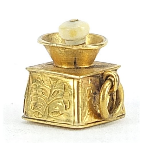 1732 - Unmarked gold coffee grinder charm with rotating handle and pull out drawer, 1.2cm high, 1.6g