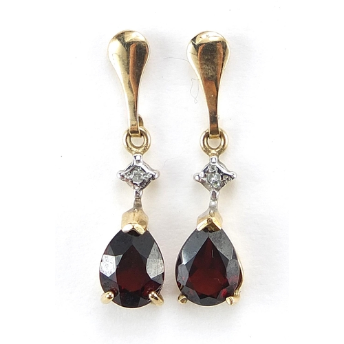 1984 - Pair of unmarked gold diamond and garnet tear drop earrings, 2cm high, 1.4g