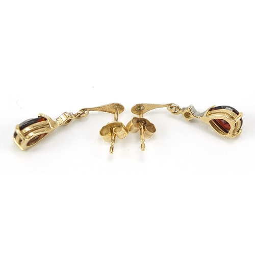 1984 - Pair of unmarked gold diamond and garnet tear drop earrings, 2cm high, 1.4g