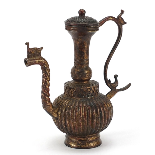 856 - Tibetan gilt bronze wine ewer, 24cm high