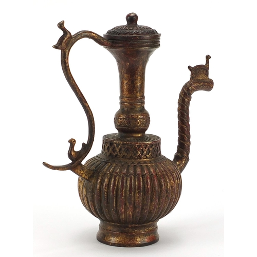 856 - Tibetan gilt bronze wine ewer, 24cm high