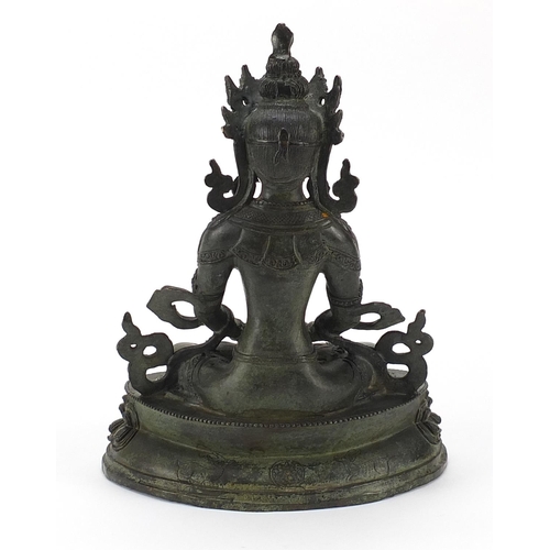 49 - Chino Tibetan patinated bronze figure of seated Buddha, 29.5cm high