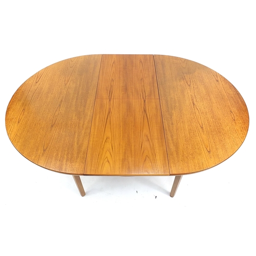 813 - McIntosh & Co, mid century Scottish teak extending dining table with four chairs, the table 75.5cm H... 