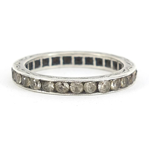 2105 - White metal white sapphire eternity ring with engraved decoration, size Q, 2.7g