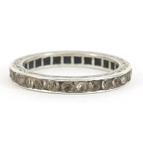 2105 - White metal white sapphire eternity ring with engraved decoration, size Q, 2.7g