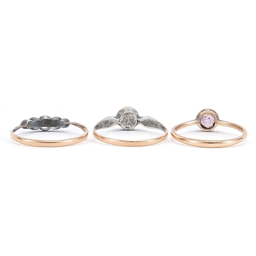 2106 - Three 9ct gold rings, two with silver set clear stones and a amethyst solitaire, sizes O, P and Q, 4... 