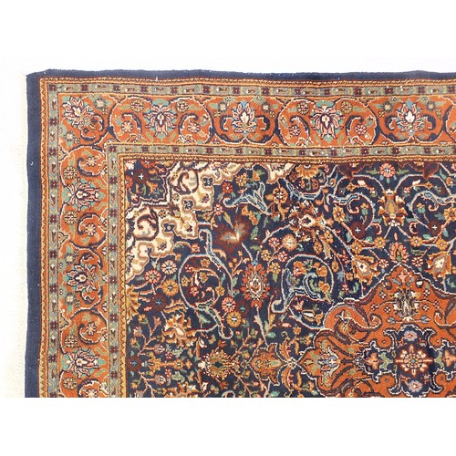 840 - Rectangular blue ground rug having an all over geometric floral design, 205cm x 145cm