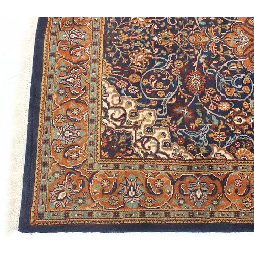 840 - Rectangular blue ground rug having an all over geometric floral design, 205cm x 145cm