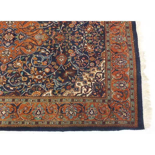 840 - Rectangular blue ground rug having an all over geometric floral design, 205cm x 145cm