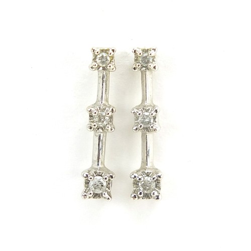 1755 - Pair of 9ct white gold graduated diamond drop earrings, each stamped 0.10, 15mm high, 1.1g