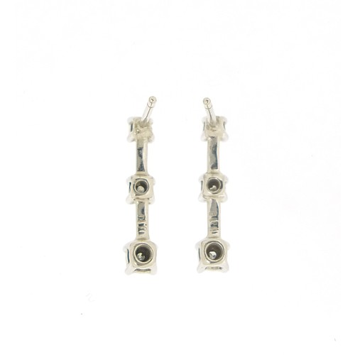 1755 - Pair of 9ct white gold graduated diamond drop earrings, each stamped 0.10, 15mm high, 1.1g