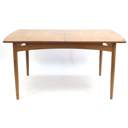 798 - G Plan E-Gomme, mid century teak extending dining table with four chairs, the table 73.5cm H x 147cm... 