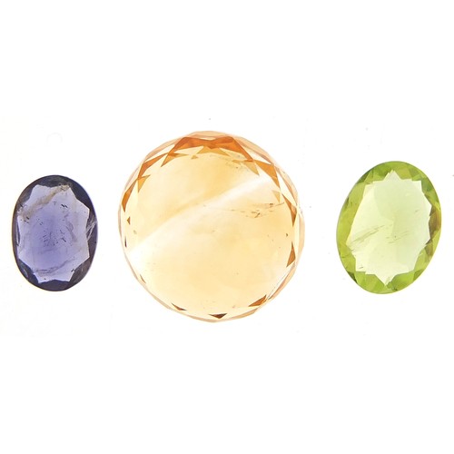 1843 - Three gemstones with certificate comprising citrine 7.250 carat, peridot 1.550 carat and iolite 0.80... 