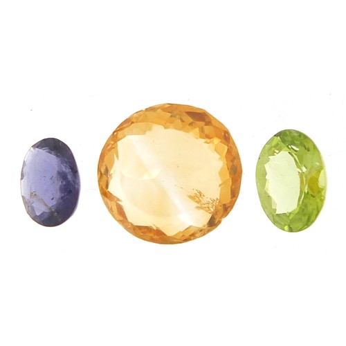 1843 - Three gemstones with certificate comprising citrine 7.250 carat, peridot 1.550 carat and iolite 0.80... 