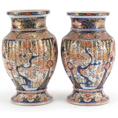 160 - Pair of Japanese Imari porcelain vases with fluted bodies, finely hand painted and gilded with flowe... 