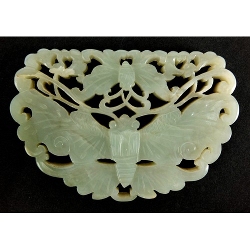 13 - Chinese celadon and russet jade panel carved with two butterflies raised on carved hardwood stand, t... 