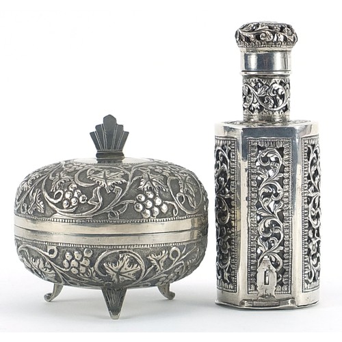 2223 - Middle Eastern silver bottle case with glass bottle and a circular silver box and cover embossed wit... 