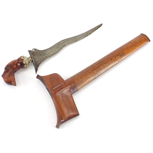 445 - Middle Eastern Sumatran kris dagger with carved hardwood handle and sheath, 30cm in length