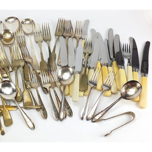 1196A - Silver plated and stainless steel cutlery, some with ivorine handles and a pair of silver sugar tong... 