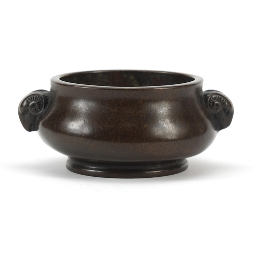 586 - Chinese patinated bronze censer with ram's head handles, character marks to the base, 11cm wide