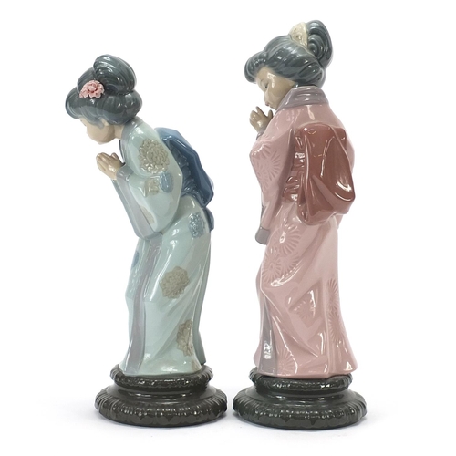 451 - Pair of Lladro figurines of Japanese Geishas, the largest 30cm high