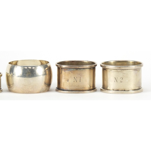 568 - Five Edwardian and later circular silver napkin rings, various hallmarks, each approximately 4.5cm i... 