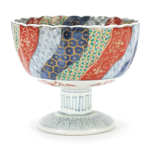 590 - Japanese Imari porcelain pedestal bowl hand painted with flowers, 13cm high x 15cm in diameter