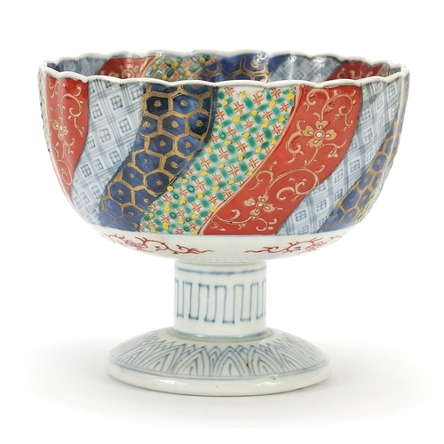 590 - Japanese Imari porcelain pedestal bowl hand painted with flowers, 13cm high x 15cm in diameter