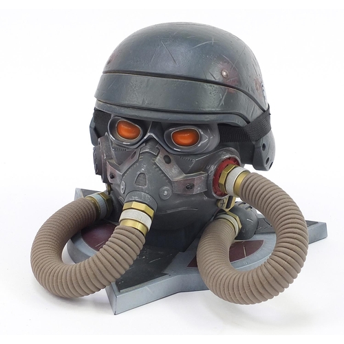 852 - The Art of Killzone 3 collector's book with pilots helmet display stand