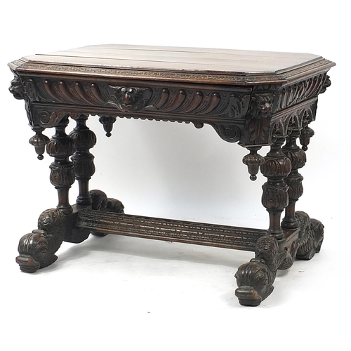 832A - Oak centre table with frieze drawer, carved with lion heads and dolphin feet, 74cm H x 102cm W x 71c... 