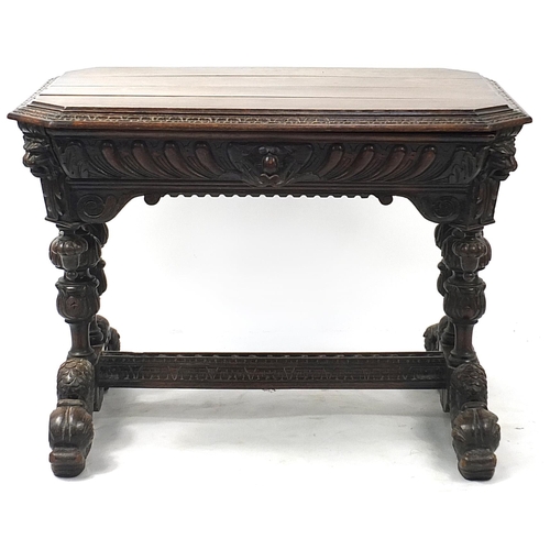 832A - Oak centre table with frieze drawer, carved with lion heads and dolphin feet, 74cm H x 102cm W x 71c... 