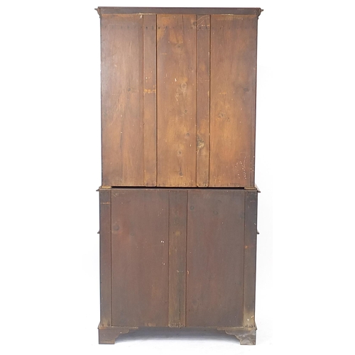 835A - Mahogany secretaire bookcase with pair of glazed doors above drawer with fitted interior and pair of... 