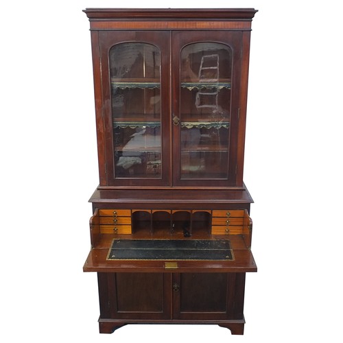 835A - Mahogany secretaire bookcase with pair of glazed doors above drawer with fitted interior and pair of... 