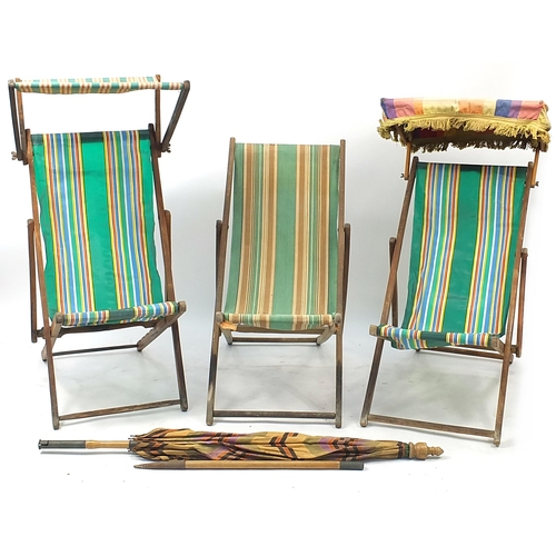 878A - Three vintage teak folding deck chairs and parasol