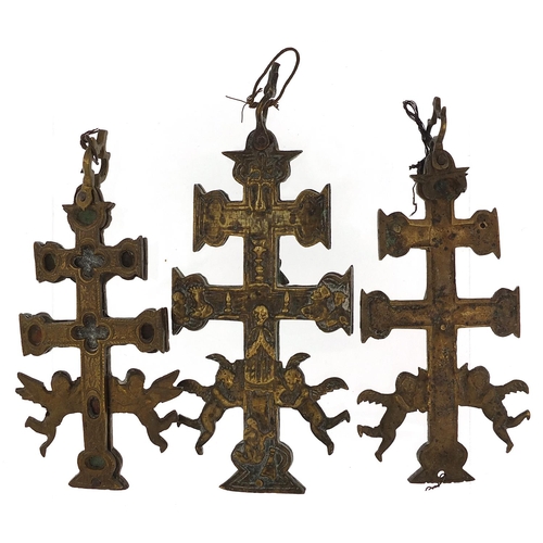 589 - Three Spanish bronzed crucifixes, the largest 13cm high