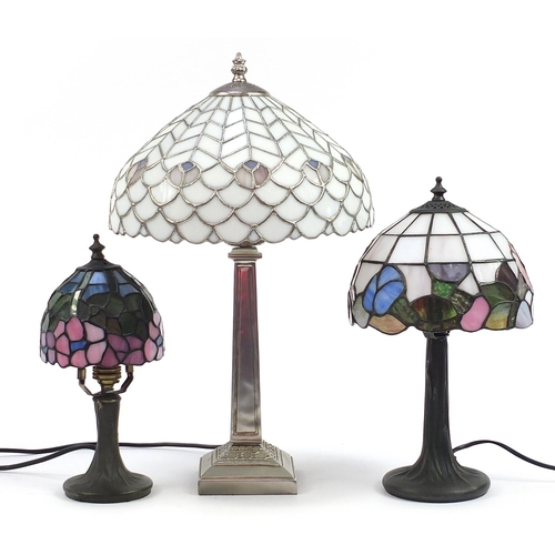 517 - Three Tiffany style table lamps with leaded glass shades, the largest 50cm high