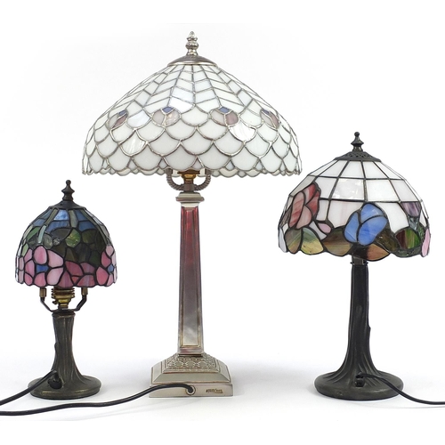 517 - Three Tiffany style table lamps with leaded glass shades, the largest 50cm high