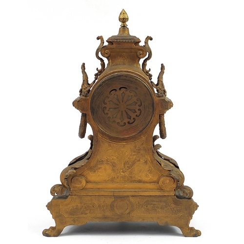 19 - Philippe Rouen, 19th century Rococo style gilt metal and black slate mantle clock, with circular dia... 