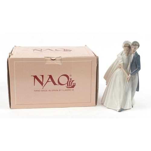 447 - Nao porcelain bride and groom figure group with box number 01247, 26.5cm high