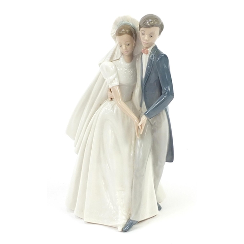 447 - Nao porcelain bride and groom figure group with box number 01247, 26.5cm high