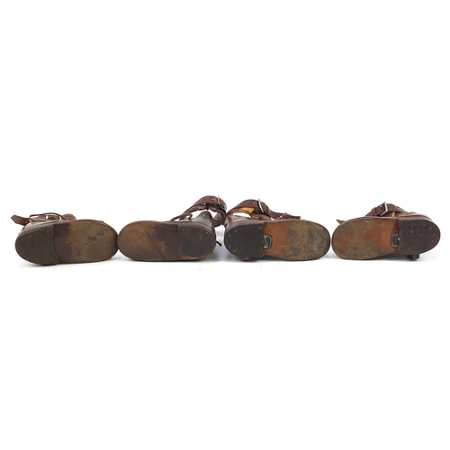 596 - Two pairs of Victorian brown leather children's disability shoes