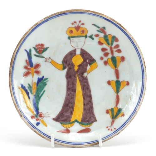 72 - Turkish Kutahya pottery dish hand painted with a figure, 15cm in diameter