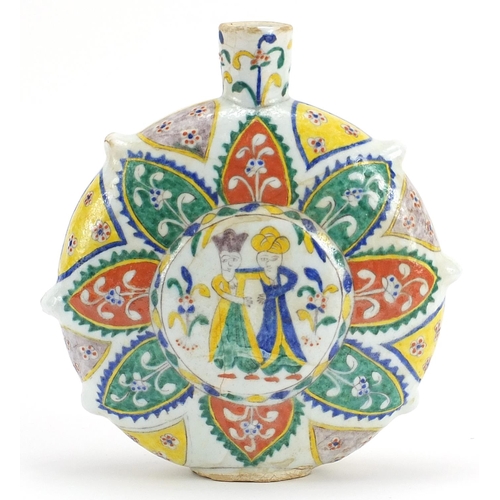 23 - Turkish Kutahya pottery water flask hand painted with figures and flowers, 21.5cm high