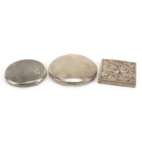 2125 - Three silver compacts including one Art Deco, the largest 8cm in diameter, total 196.2g